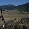 Tourist Spotting Black Necked Crane using Scope